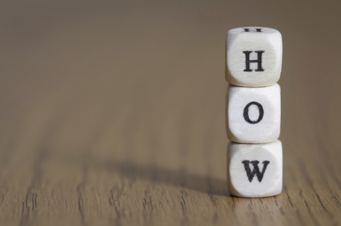 Stacked cubes spelling out the word 'how'